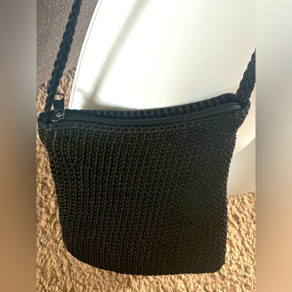 Black woven crossbody bag. Can dress up or down
